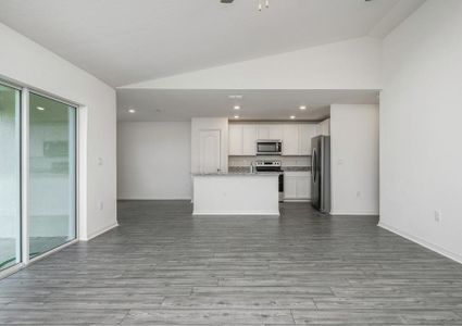 The family has a sliding glass door that leads to the backyard