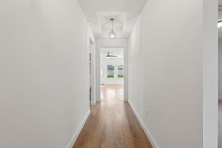 Corridor featuring wood-type flooring