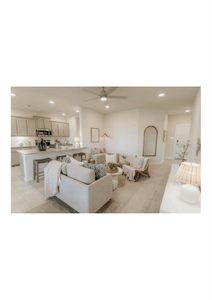 Unfurnished living room featuring ceiling fan and light tile patterned floors