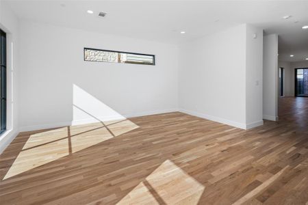 Unfurnished room with hardwood / wood-style flooring