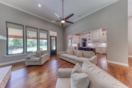 This open concept home features vaulted ceilings, wood burning fireplace, & an oversized island.