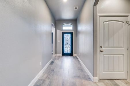 Entryway with light hardwood / wood-style flooring