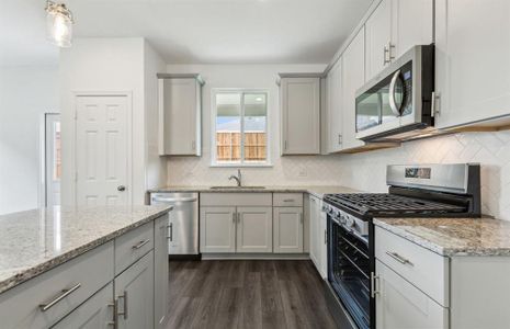 Bright gathering room with large windows *real home pictured