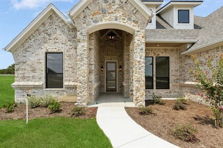 Property entrance featuring a lawn