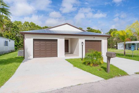 New construction Single-Family house 12 Mediterranean Boulevard N, Port Saint Lucie, FL 34952 - photo 0