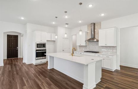 Bright kitchen with oversized island  *real home pictured