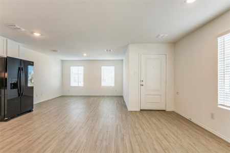 Unfurnished living room featuring light hardwood / wood-style flooring