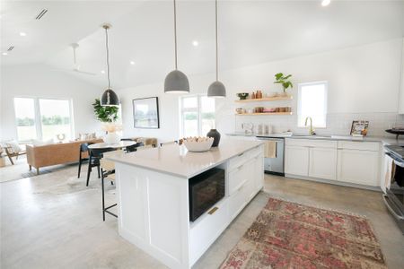 Open Concept Floorplan, with vaulted ceilings, flooded with natural light. Offering minimalistic yet high-end finishes through out the entire Hacienda.