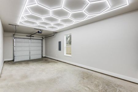 Garage featuring electric panel