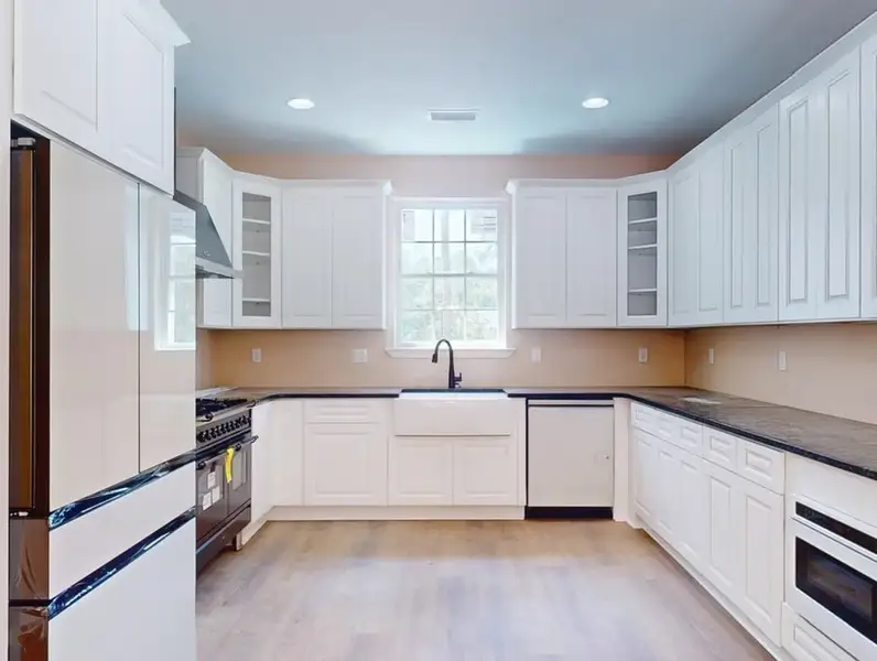 A showcase of a new construction home by Quality Family Homes, LLC, highlighting their design and quality (Image 9).