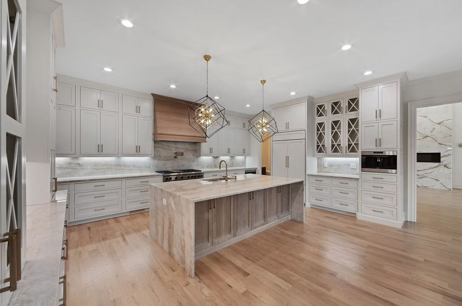 A showcase of a new construction home by Hyde Park Homes, Inc., highlighting their design and quality (Image 9).