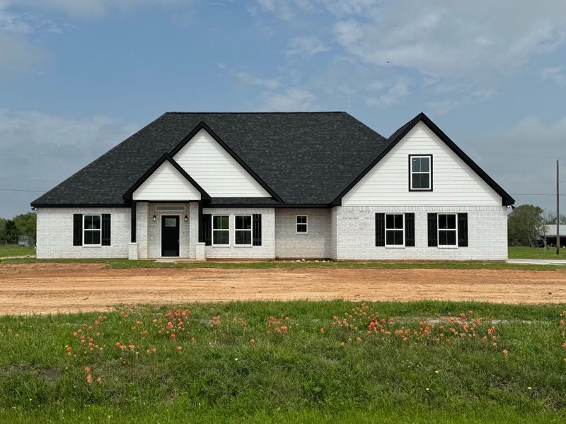 A showcase of a new construction home by Heritage Custom Home, highlighting their design and quality (Image 4).