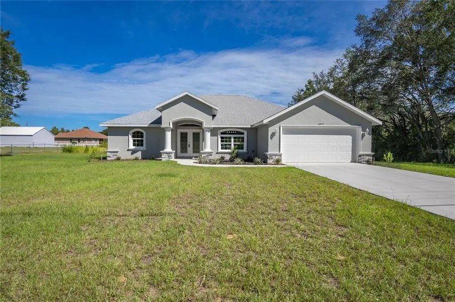 A showcase of a new construction home by Bruce Kaufman Inc, highlighting their design and quality (Image 1).