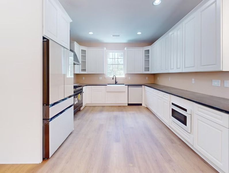 A showcase of a new construction home by Quality Family Homes, LLC, highlighting their design and quality (Image 6).