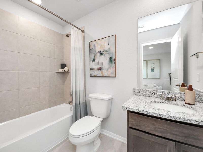 Furnished interior in a model home at Sunterra in Katy (Image 33).