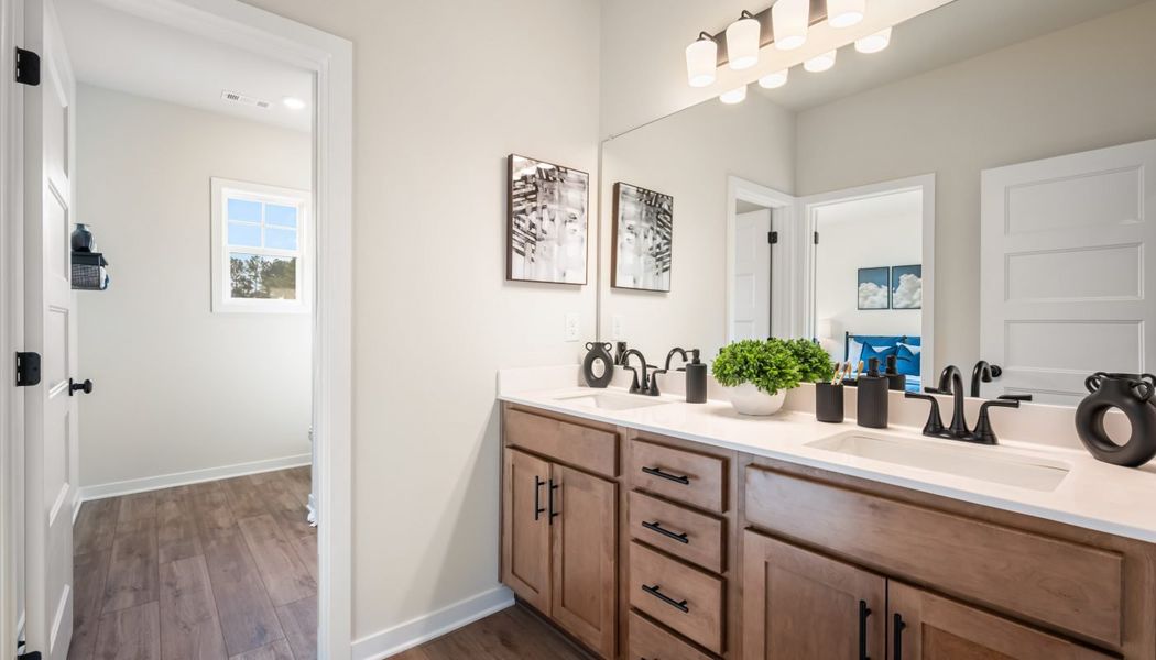 Furnished interior in a model home at Pinecrest Ridge in Dacula (Image 40).