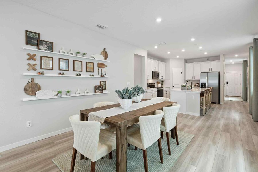 A kitchen with a dining table. A kitchen with a dining table.