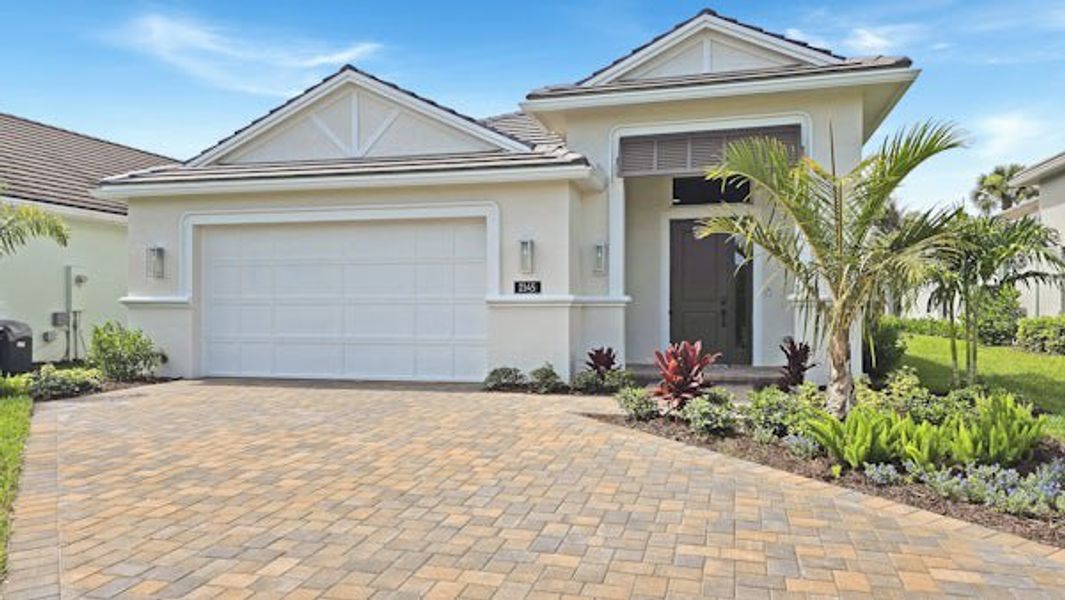 Front exterior of a home in the The Falls at Grand Harbor community, located in Vero Beach, FL (Image 51).