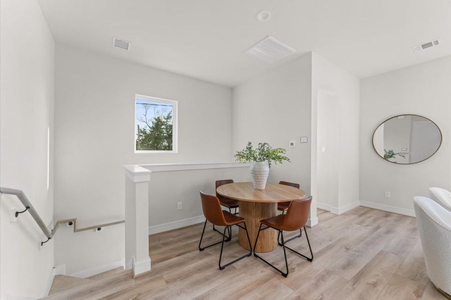 Furnished interior in a model home at Highland Gardens in Houston (Image 9).
