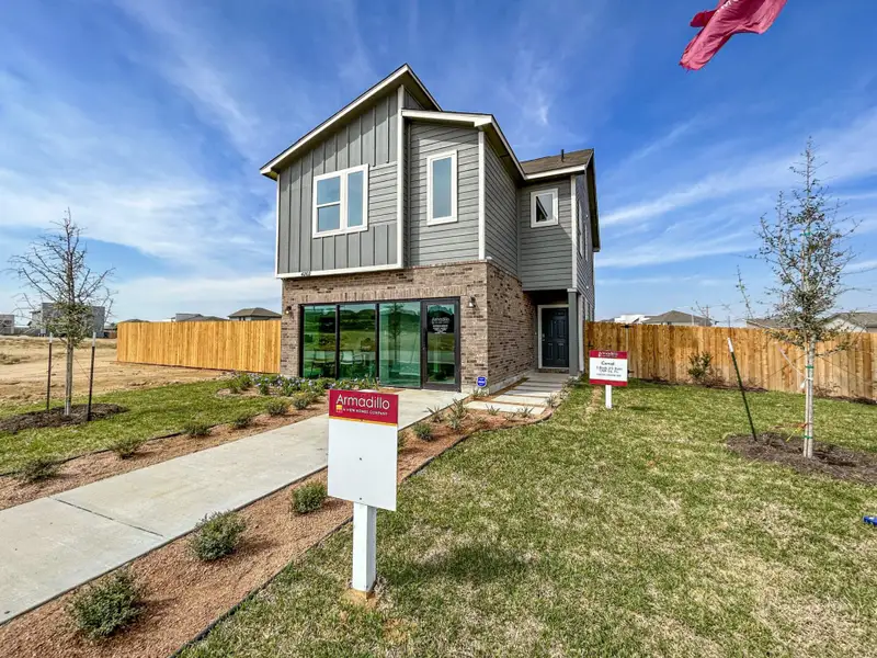 Front exterior of a home in the Cuatro Vientos Sur community, located in Laredo, TX (Image 1).