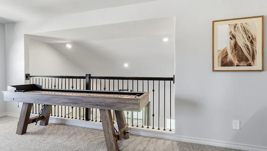 Furnished interior in a model home at The Woodlands at Medina Hills in Mico (Image 38).