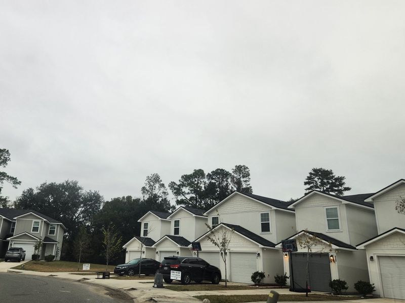 Modern townhomes with garages in Lakeside Townhomes by Lennar, nestled in a serene neighborhood in Jacksonville, FL. Modern townhomes with garages in Lakeside Townhomes by Lennar, nestled in a serene neighborhood in Jacksonville, FL.