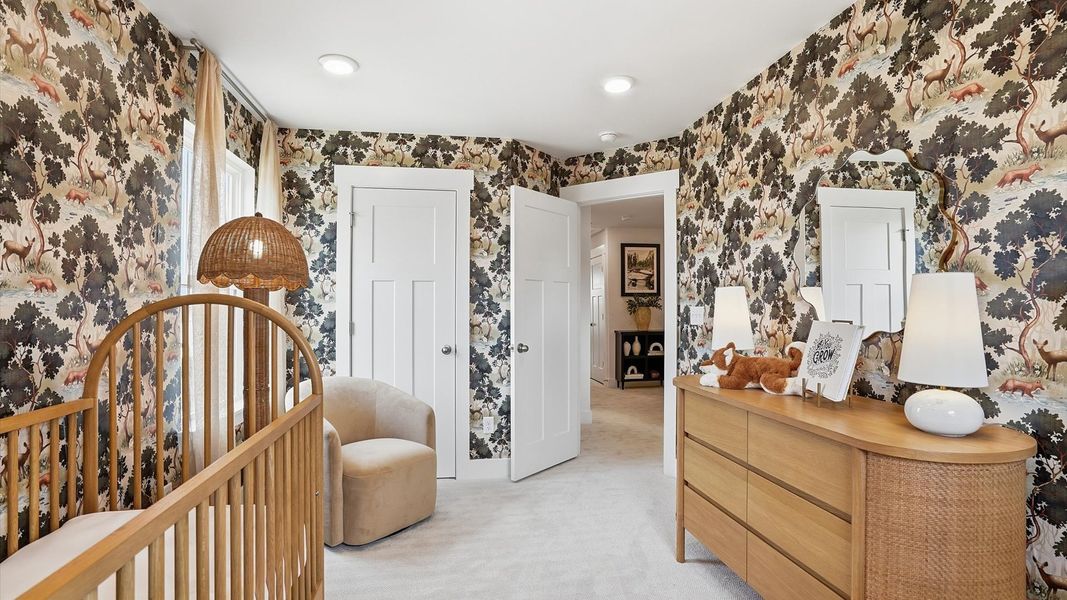 Bright and serene bedroom with comfortable carpeted flooring and large windows for vibrant light in Simpsonville, SC Bright and serene bedroom with comfortable carpeted flooring and large windows for vibrant light in Simpsonville, SC