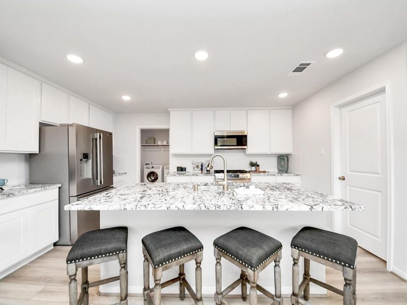 Furnished interior in a model home at Sunterra in Katy (Image 7).