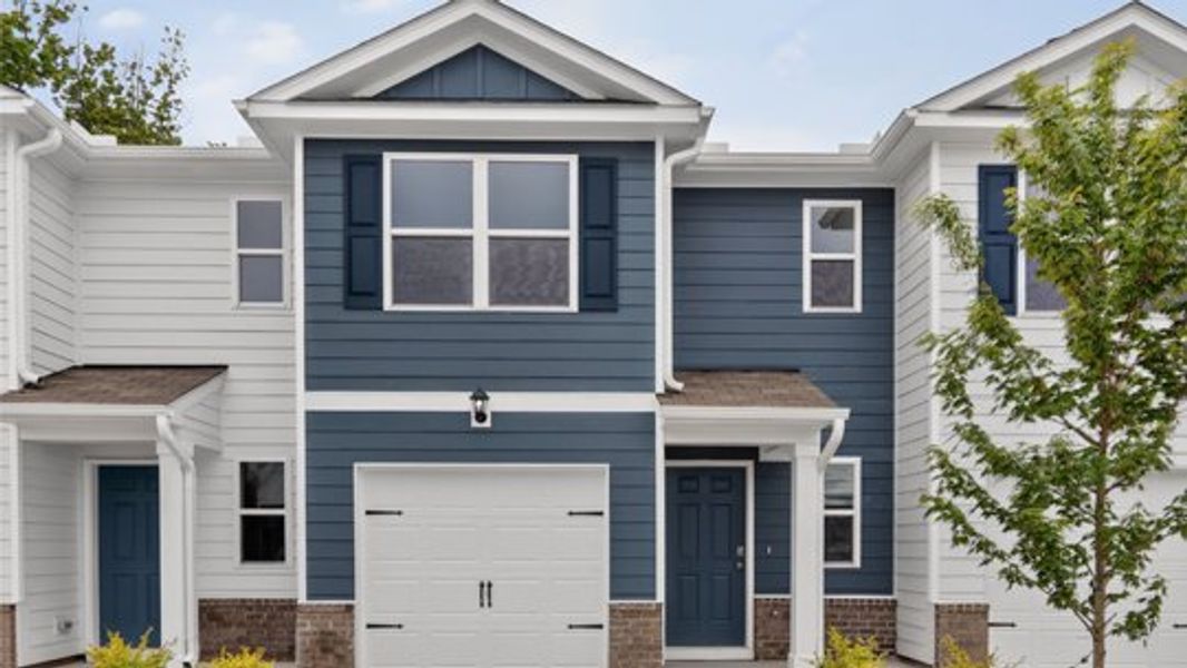 Front exterior of a home in the The Townes at Belle Grove community, located in Wendell, NC (Image 22). Front exterior of a home in the The Townes at Belle Grove community, located in Wendell, NC (Image 22).