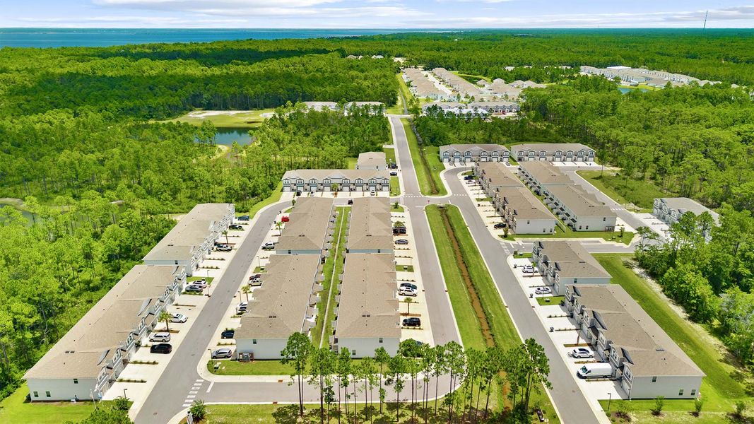 Aerial view of the Hawks Landing Townhomes community in Santa Rosa Beach, FL, showing layout and nearby surroundings (Image 8). Aerial view of the Hawks Landing Townhomes community in Santa Rosa Beach, FL, showing layout and nearby surroundings (Image 8).