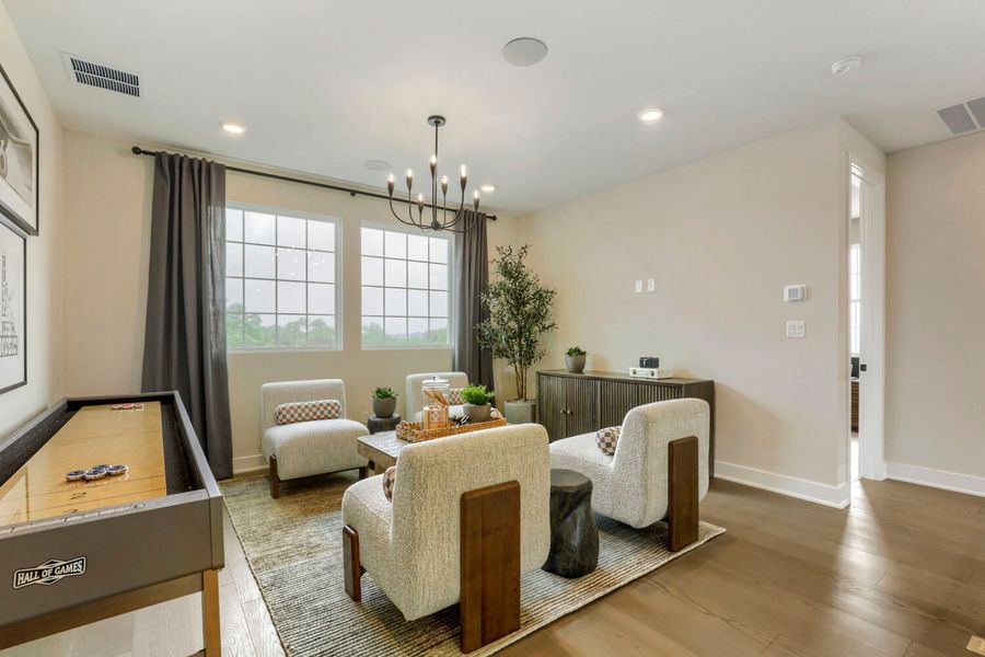 Furnished interior in a model home at Manors Collection - Freedom at Anthem in Kyle (Image 10).