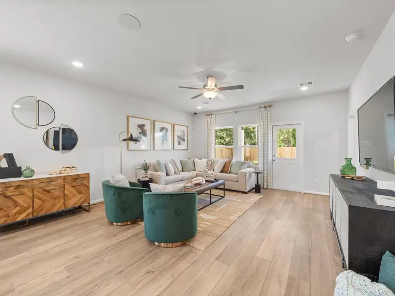 Furnished interior in a model home at Caney Creek Place in Conroe (Image 4).