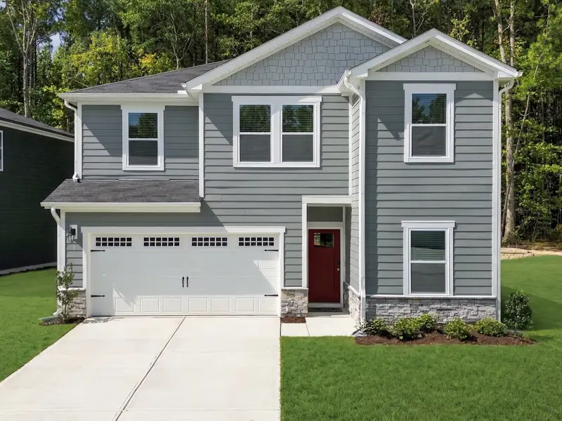 Front exterior of a home in the The Heritage at Buffaloe Reserve community, located in Raleigh, NC (Image 2). Front exterior of a home in the The Heritage at Buffaloe Reserve community, located in Raleigh, NC (Image 2).