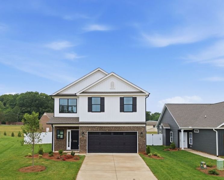 Front exterior of a home in the Sullivans Reserve community, located in Walkertown, NC (Image 13). Front exterior of a home in the Sullivans Reserve community, located in Walkertown, NC (Image 13).