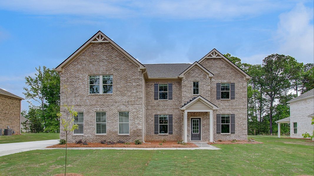 Front exterior of a home in the Cambria at Traditions community, located in Hampton, GA (Image 9).