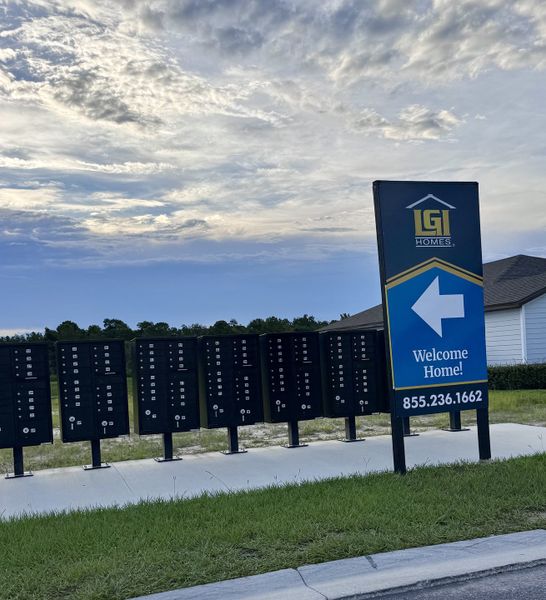 Community mailboxes with a welcoming LGI Homes sign in Rolling Hills by LGI Homes (Green Cove Springs, FL).