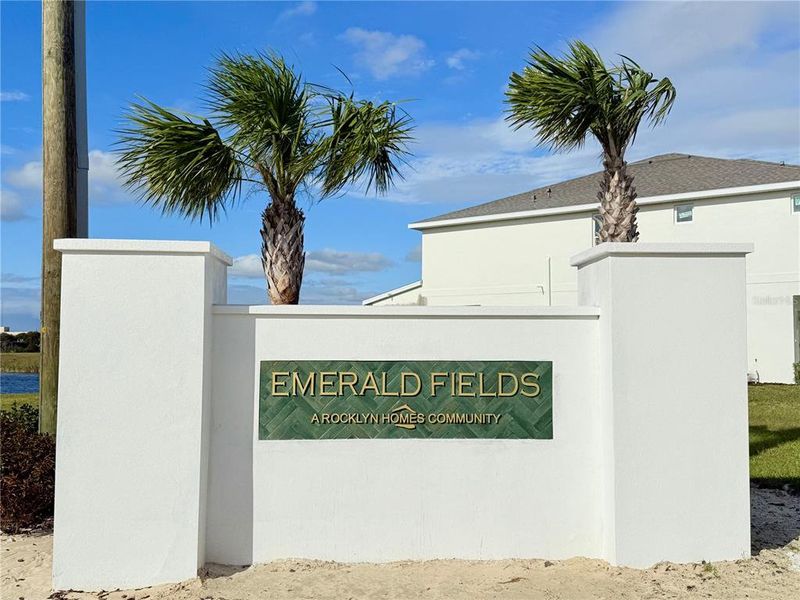 Entrance to the Emerald Fields community in Hudson, FL, featuring signage and landscaping (Image 1).