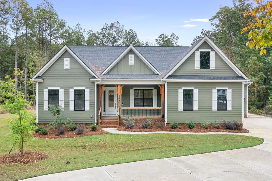 Beautiful Ranch with Upstairs Retreat in Shepherds Trace. This open concept features an Epicurean Kitchen with quartz countertops, double wall ovens, and farmhouse island, opening to Casual Dining and Family Room with coffered ceiling and stone fireplace.