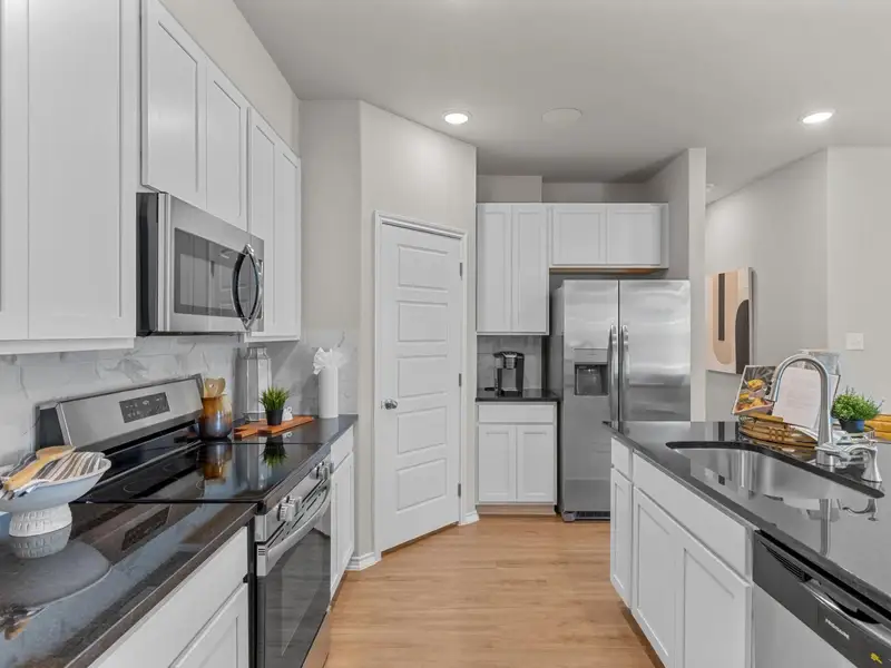 Furnished interior in a model home at Meadows at Oak Creek in San Antonio (Image 4).