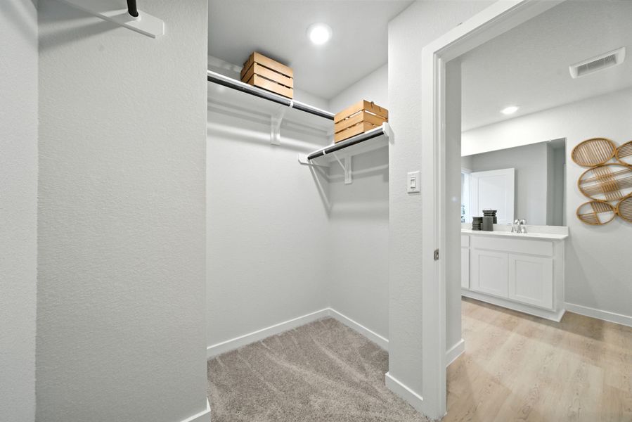 A bathroom with a mirror and a sink. A bathroom with a mirror and a sink.