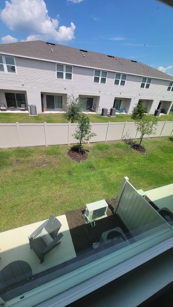 A modern townhouse with a private patio in The Townhomes at Westview by Taylor Morrison (Kissimmee, FL).