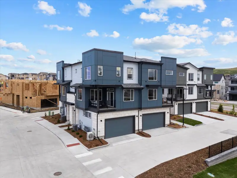 Front exterior of a home in the Lyric at RidgeGate Townhomes community, located in Lone Tree, CO (Image 2).