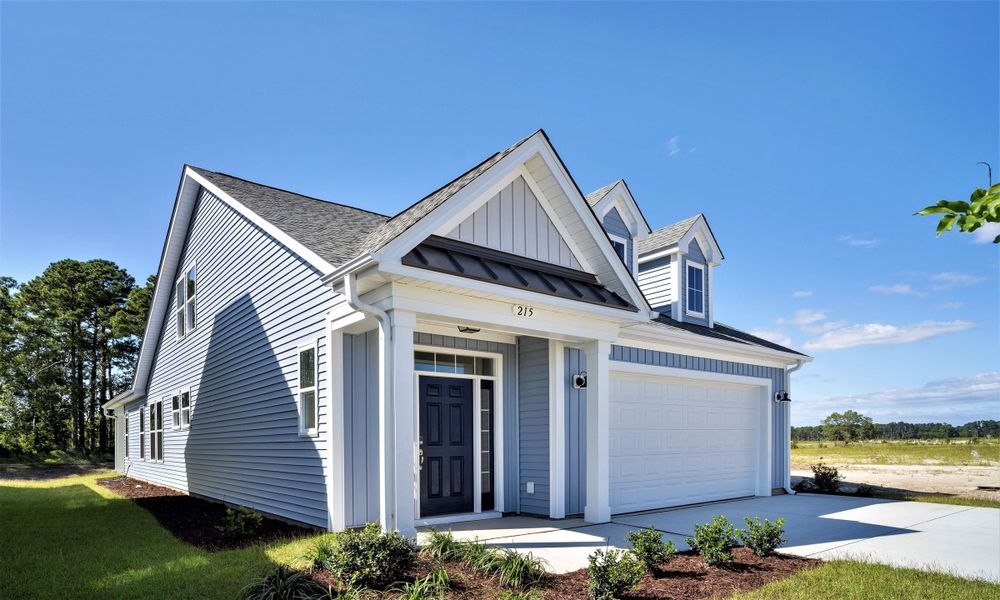 Front exterior of a home in the Bridgewater - Shorehaven Village community, located in Little River, SC (Image 11).