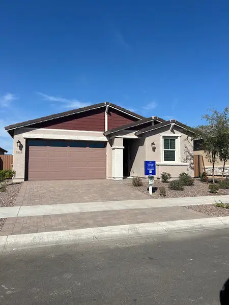 A modern bungalow with a two-tone facade and a neat, landscaped front yard in Avion: Arbor by Lennar (Goodyear, AZ).