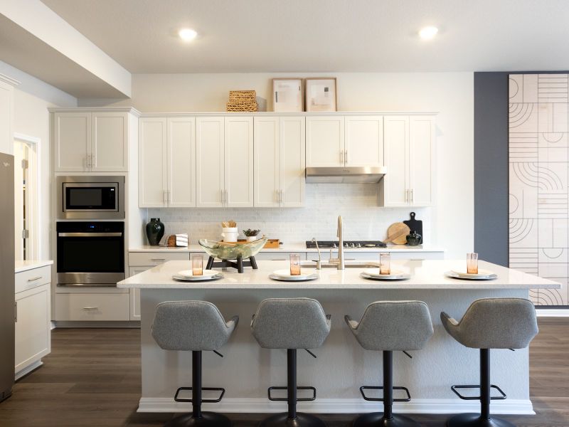 The large kitchen island provides great room for some barstools.