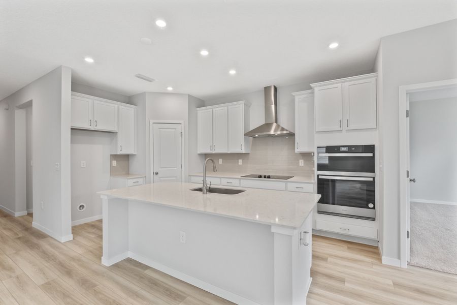 Palmetto Floorplan Lot 145 Kitchen with White Cabinets at Seminole Palms in Palm Coast Palmetto Floorplan Lot 145 Kitchen with White Cabinets at Seminole Palms in Palm Coast