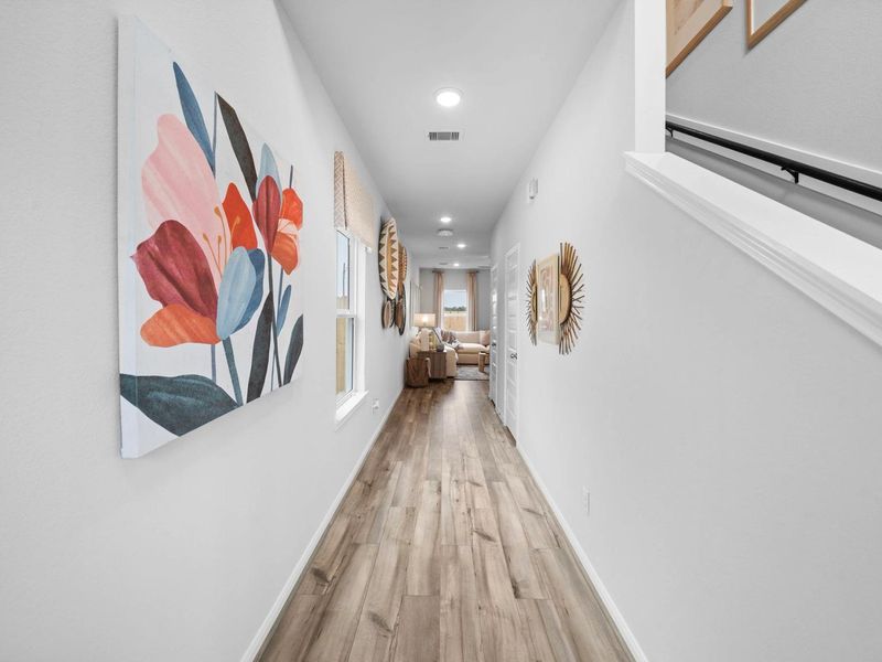 Furnished interior in a model home at Hill & Dale Ranch in Splendora (Image 5).