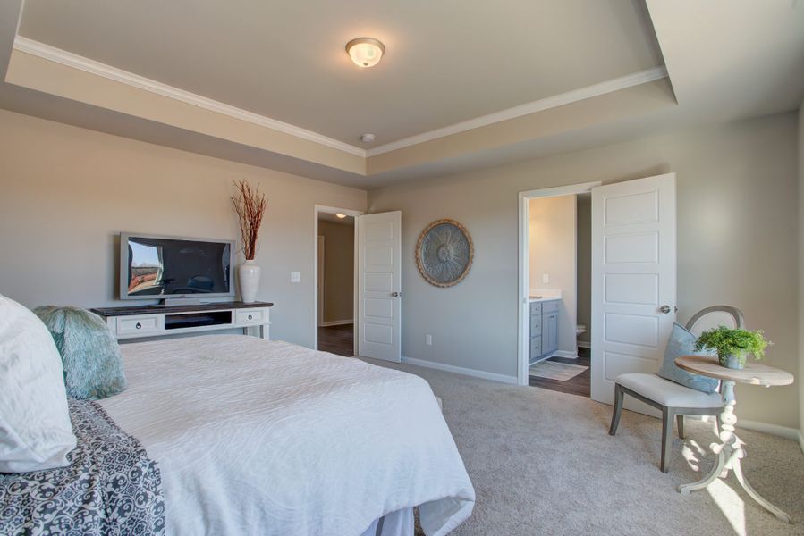 Furnished interior in a model home at Legends at Old Monroe in Monroe (Image 28).