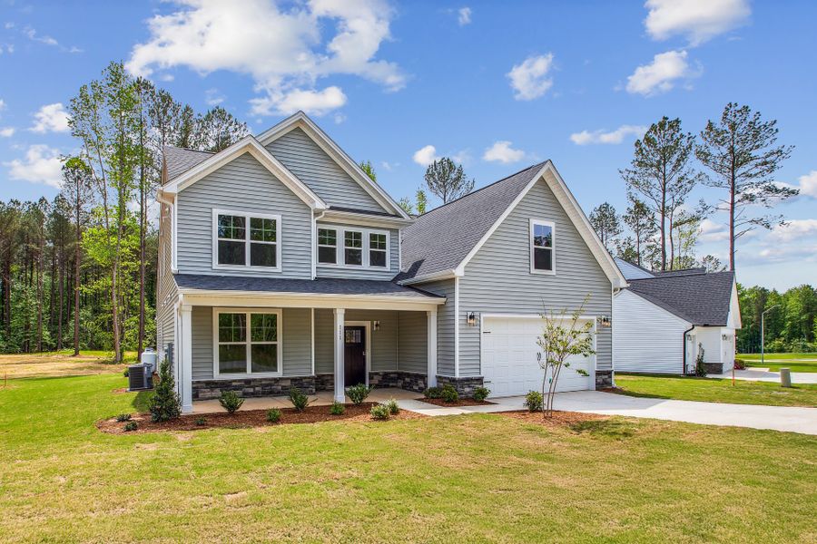 Front exterior of a home in the Magnolia Acres community, located in Fuquay Varina, NC (Image 12). Front exterior of a home in the Magnolia Acres community, located in Fuquay Varina, NC (Image 12).