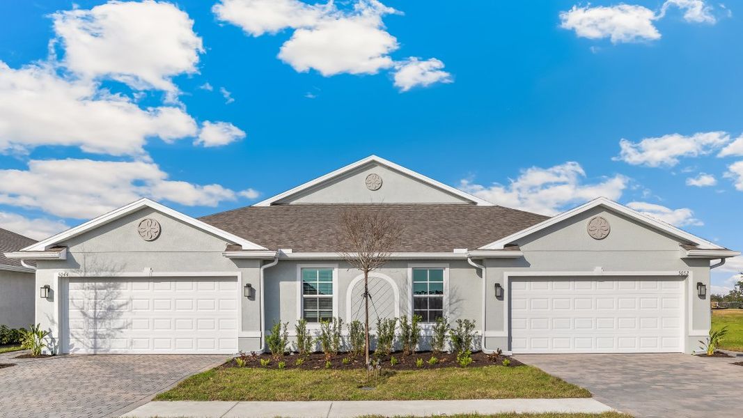 Front exterior of a home in the Central Parc community, located in North Port, FL (Image 8).